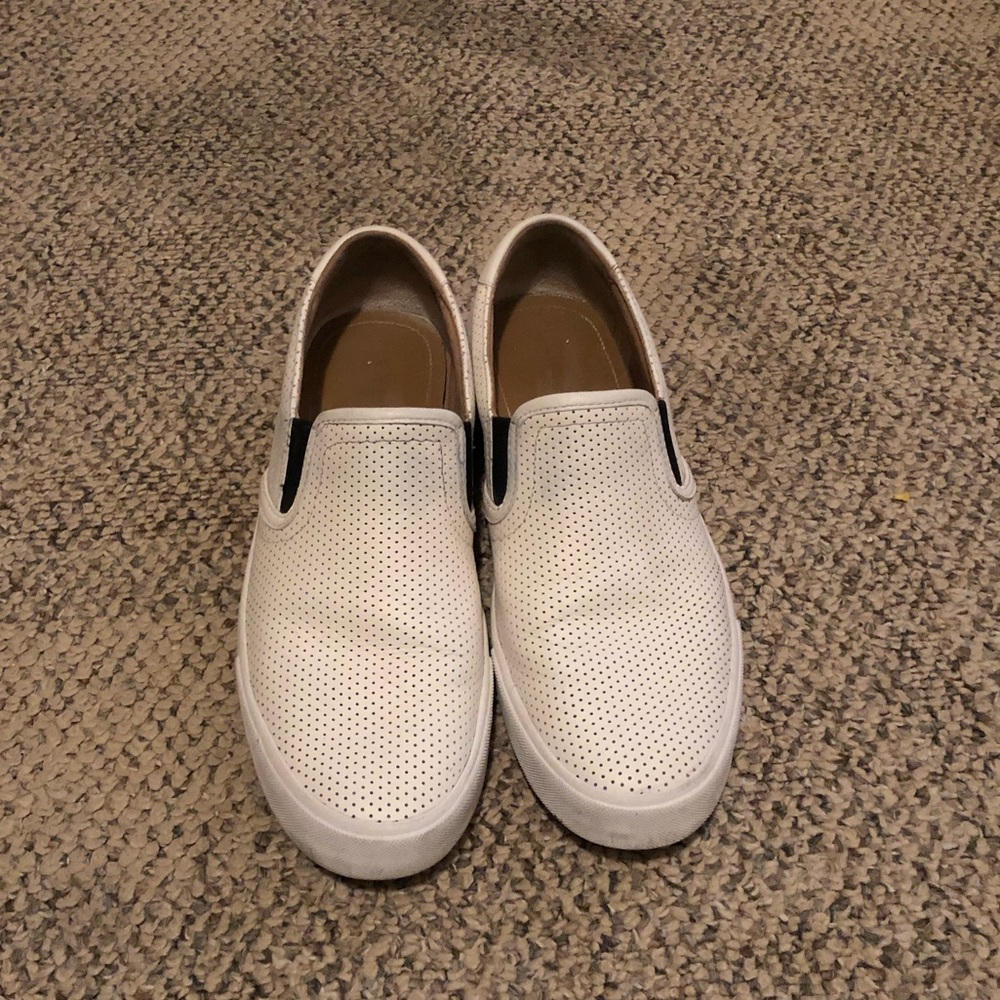 White leather slip ons